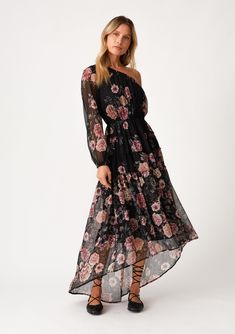 A dreamy one-shoulder boho maxi dress designed in a black and pink floral print. Floral print Chiffon Relaxed fit Long sleeve One shoulder Elastic cuff Maxi length High/low ruffle-trimmed tiered skirt Smocked elastic neckline Elastic waist Lined Bohemian maxi dress An ultra-special dress for your next special occasion. Designed in a feminine floral print, with a one-shoulder silhouette and a dramatic high/low tiered skirt. The light-as-air chiffon fabric and flowy skirt create an ethereal effect Maxi Dress Designs, One Shoulder Maxi Dress, Special Dress, Bohemian Maxi, Floral Print Chiffon, Bohemian Maxi Dress, High Low Skirt, Special Dresses, Pink Floral Print