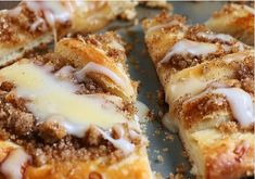 cinnamon roll with icing on top sitting on a plate