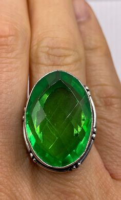 Large brilliant emerald green antique glass  Ornate German Silver  NOT 925  Vintage ring, does not tarnish my jeweler charges a $20 fee All rings are shipped free in the US in a nice gift box.   Check out our over a THOUSAND great reviews Engraving is $4 per letter and is not always perfect depending on the piece. It can take a few days if the jeweler is busy. This is payable to Paypal Judithsltd@gmail.com Faceted Rings For May Birthstone Gifts, Green Nickel-free Ring As Gift, Emerald Faceted Ring As A Gift, Nickel Free Green Ring As A Gift, Green Rings For Jewelry Making May Birthstone, Faceted Ring Gift For May Birthstone, Vintage Green Crystal Ring For Anniversary, Green Faceted Ring For Anniversary, Emerald Jewelry With Large Stone As A Gift