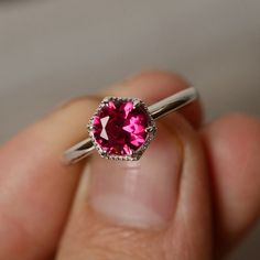 This is a gorgeous handmade creation. Its beauty is its simplicity & Elegance. The 7mm round cut Lab ruby is crafted in solid sterling silver and with rhodium plated. All item is sent in a beautiful gift box You can realize more lovely stuff clicking the link https://www.etsy.com/shop/knightjewelry?refshopsection_shophome_leftnav Please leave the correct address and you phone number for delivering successfully. 14k White Gold Ruby Ring With Halo Setting, Elegant Ruby Ring With Halo Setting, Timeless Sapphire Ring Gift, Elegant Platinum Ruby Ring With Round Cut, Elegant White Gold Ruby Ring, Sterling Silver Timeless Birthstone Ring, Timeless Sterling Silver Birthstone Ring With Gemstone, Elegant Brilliant Cut Ruby Ring Gift, White Gold Ruby Ring In Platinum