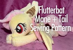 a stuffed toy with the words flutterbat mane + tail sewing pattern