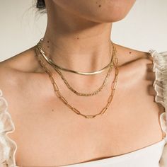 Our Chunky Paperclip Necklace is the perfect chain for those who want to add a bold pop to their look! It's a statement piece while still being minimal enough to wear daily. You can wear it from the gym, to the shower, and even to sleep! DETAILS Necklace length: 16" with 2" extender 14k gold filled -or- sterling silver chain, lobster clasp, & findings Link size: 3.7mm x 13mm Matching bracelet: Chunky Paperclip Bracelet Gold Herringbone Necklace, Chunky Gold Chain Necklace, Puzzle Piece Necklace, Paperclip Bracelet, Paperclip Necklace, Chunky Gold Chain, Paperclip Chain Necklace, Thick Chain Necklace, Picture Necklace