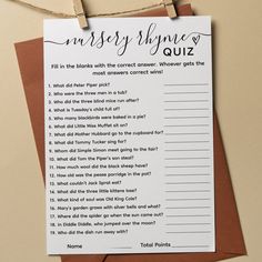 a printable question card on top of a piece of brown paper hanging from a clothes line