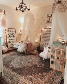 a room decorated in pink and white with lots of decorations