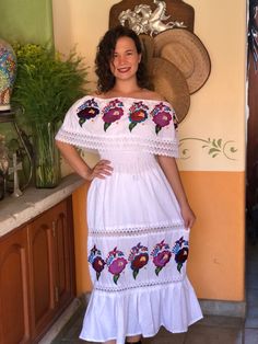 Beautiful traditional Mexican peasant dress, embroidered with bright colors of silk thread. Dress with spring at the waist and lace details to show off on any occasion. The embroidery of each dress is unique, so the colors may vary. Mexican textile art has centuries of history and creativity throughout the country. Mexico is recognized as one of the leading countries with a beautiful artistic production in the textile world, miraculous hands of talented artisans from different states of the coun Traditional Floral Embroidered Maxi Dress, Traditional Maxi Dress With Multicolor Floral Embroidery, White Floral Embroidered Dress For Traditional Ceremonies, White Floral Embroidery Dresses For Traditional Ceremonies, Folk Dresses With Multicolor Embroidery For Traditional Ceremonies, Folk Style Dress With Multicolor Embroidery For Traditional Ceremonies, Spring Dresses With Intricate Embroidery For Traditional Ceremonies, Intricate Embroidery Dresses For Traditional Spring Ceremonies, Spring Maxi Dress For Traditional Ceremonies