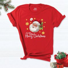 "Santa Claus Shirt, Christmas Shirt, Merry Shirt, Christmas t-shirt, Christmas Gift Shirt, Papa Claus Christmas Tee, Christmas Family Shirt. HI! Welcome to my store, I'm delighted to see you here. My store's main goal is to provide you with premium everyday apparel with the best graphic t-shirts. I see you as a friend, not just a customer. I'm sure you'll love my designs. So, here is a brief description for you to-see-the order-process: 1. Please, Check and Review all Photos. 2. Select Your T-Sh Red Graphic Tee For Christmas, Red Christmas Graphic Tee, Christmas Holiday T-shirt With Short Sleeves, Christmas Cotton T-shirt Gift, Christmas Holiday Short Sleeve T-shirt, Christmas Gift Short Sleeve T-shirt, Red Crew Neck T-shirt For Christmas, Red Short Sleeve T-shirt For New Year, Christmas Graphic Tee T-shirt As Gift