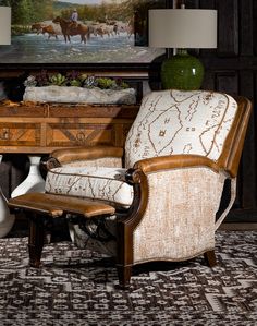 a chair and table in front of a painting