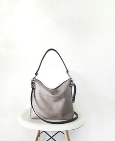 Medium/ large hobo style bag The body of the bag is made of high quality faux vegan leather in rustic distressed in light gray color. (Also available in black and brown). It is fully lined with cotton fabric black * two inner slip pockets perfect for phone, keys, cardholder etc. *Metal zipper closure *the shoulder strap and the crossbody strap (if added) are made of cowhide leather for extra support * additional crossbody strap can be added (please choose the option from the dropdown menu) *silv Versatile Hobo Shoulder Bag For Errands, Trendy Hobo Bag For Everyday Use, Hobo Bag With Adjustable Strap For Errands, Versatile Hobo Bucket Bag For Errands, Versatile Hobo Satchel For Errands, Trendy Gray Large Capacity Hobo Bag, Everyday Satchel With Single Shoulder Strap And Double Handle, Versatile Hobo Shoulder Bag With Adjustable Strap, Hobo Bag With Single Shoulder Strap For Errands