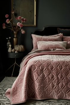 a bedroom with black walls and pink bedding