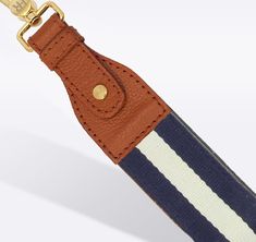 Our signature detachable, interchangeable, and adjustable bag straps are designed to give you maximum versatility for all your favorite handbags. Simply switch out your strap or change the size to give your purse and your outfit a whole new look. Backed in ultra-soft leather, these interchangeable purse straps are as durable as they are comfortable. Every striped strap features a gold slider so you can adjust it from a shoulder strap to a cross-body strap. And, our custom hardware is durable eno Adjustable Bag Strap With Key Leash For Everyday, Everyday Use Crossbody Bag Strap With Key Leash, Everyday Crossbody Bag Strap With Key Leash, Adjustable Bag Strap With Leather Handles For Travel, Luxury Bag Strap With Adjustable Strap For Everyday Use, Adjustable Leather Handle Crossbody Shoulder Strap, Adjustable Leather Crossbody Strap With Handles, Luxury Detachable Bag Strap For Everyday Use, Luxury Adjustable Strap Bag Strap For Everyday Use