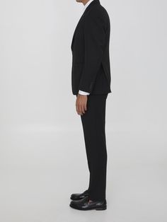 Two-piece suit in black virgin wool. Single-breasted jacket with classiclapels, brooch on lapel, front button closure, two front welt pockets, a welt pocket on chest and buttoned cuffs. Straight-leg trousers with zip, button and hook-and-eye closure, two side welt pockets and two rear buttoned welt pockets. Regular fit. Size nationality: ITComposition: 97% Virgin Wool, 3% Elastane Leather Cap, Single Breasted Jacket, Wool Suit, Straight Leg Trousers, Blazers For Men, Designer Suits, Denim Pant, Italian Fashion, Lanvin