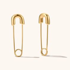 The unique design features a sleek and simple pin, creating a look that is both modern and sophisticated.These earrings are durable and long-lasting, ensuring that they will be a cherished addition to your jewelry collection for years to come. Perfect for dressing up any outfit, these earrings are a must-have for any fashion-conscious individual. Trendy Everyday Paperclip Earrings, Trendy Paperclip Earrings As Gift, Trendy Paperclip Earrings For Gift, Simple Metal Earrings, Modern Paperclip Earrings For Pierced Ears, Paperclip Shaped Metal Earrings As Gift, Trendy Paperclip-shaped Earrings As Gift, Safety Pin Earrings As Gift, Minimalist Safety Pin Jewelry For Pierced Ears