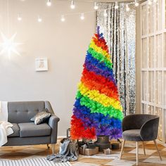 a rainbow christmas tree in a living room