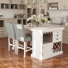 a kitchen island with two chairs next to it and wine bottles on the counter top