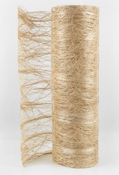 two rolls of jute twine sitting next to each other on a white surface