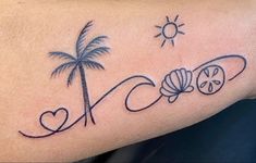 a tattoo on the arm of a woman with a palm tree and seashells