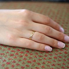 Gold KT: 14K
Gold Color Option: Rose Gold, Yellow Gold, White Gold
Band Thickness: 1.2MM (thickness of 2 furthest points 4.5MM)

Give a gift that will last a lifetime with our striking gold infinity ring. This gold ring is made with two 14k gold bands each with a width of 1.2mm. A beautiful symbol of everlasting love, this handcrafted gold ring will make a thoughtful gift for the one you cherish. 14k Gold Infinity Jewelry For Wedding, Infinity 14k Gold Jewelry For Wedding, Infinity Yellow Gold Jewelry For Wedding, 14k Gold Infinity Jewelry For Anniversary, Elegant Gold Infinity Ring, Delicate Infinity Yellow Gold Jewelry, Elegant Hypoallergenic Infinity Ring, Gold Infinity Jewelry For Wedding, Infinity Wedding Ring