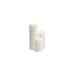 three white candles sitting next to each other