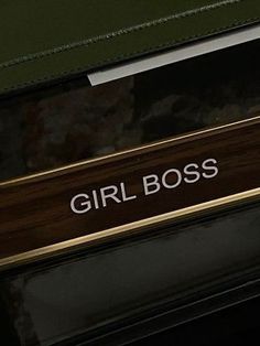 the girl boss sign is on the side of a car