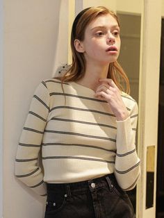 This product is a classic striped round knitwear, offering a timeless design that pairs well with a variety of bottoms. The ribbed texture and fitted silhouette provide a sleek appearance, making it a staple for both casual and smart-casual looks. It's an essential piece for anyone looking to add a sophisticated yet comfortable item to their wardrobe. - Striped design adds a bold, graphic element to the knitwear, allowing for easy styling with simple or layered outfits.- Ribbed texture not only contributes to the aesthetic but also ensures a snug and flexible fit.- Crafted with a blend of materials that offer durability and softness for everyday wear.- The round neckline complements various body types and adds a clean line to the neck area. Striped Knit Sweater For Work, Classic Striped Tops With Ribbed Cuffs, Classic Striped Sweater With Ribbed Cuffs, Chic Striped Fitted Sweater, Elegant Striped Sweater For Spring, Classic Striped Crew Neck Sweater, Classic Striped Knit Sweater, Striped Sweater For Work, Classic Striped Sweater For Work