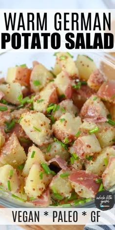 a bowl filled with potatoes and ham on top of a table