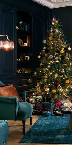 a living room with a christmas tree in the corner