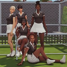 a group of women in tennis uniforms posing for a photo