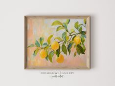 an oil painting of lemons hanging on a wall