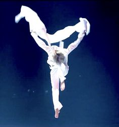 a person doing a handstand in the air