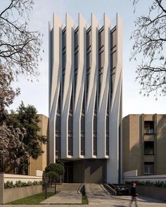 the building is designed to look like it's made out of concrete and has wavy lines