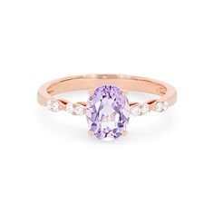 an oval shaped pink sapphire and diamond ring