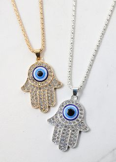 shimmery, rhinestone hamsa hand + evil eye necklace comes with an adjustable chain clasp for easy and a comfortable wear comes in both gold and silver Hamsa Hand Necklace, Hand Evil Eye, Hand Necklace, Jewelry Accessories Ideas, Accessories Ideas, Evil Eye Necklace, Earrings Rings, Hamsa Hand, Eye Necklace