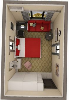 an overhead view of a small bedroom with a red bed