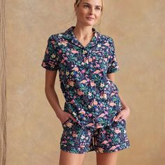 A favorite fit for hanging around, this pajama shirt features soft, printed material for the absolute most amount of comfort. 95% cotton, 5% spandex jersey knit Printed with solid piping trim detail Short sleeve Button front. Vera Bradley Outlet Women's Short-Sleeved Button Up Pajama Top in Flamingo Garden, Size: Medium | Cotton/Spandex Flamingo Garden, Button Up Pajamas, Cotton Pyjamas, Pajama Shirt, Pajama Top, Short Sleeve Button Up, Trim Detail, Top Women, Knit Cotton