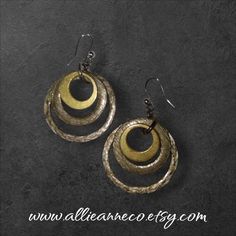 Hammered Hoop Shape Earrings.  I sell only vintage or pre-owned jewelry and I use my pictures as part of the description. As with most vintage items there may be wear consistent with the age.  Find more unique vintage earrings and jewelry in my store at AllieAnneCo.etsy.com Thank you for stopping by! 😊 https://www.etsy.com/shop/AllieAnneCo Metal Small Hoop Earrings With Ear Wire, Small Hoop Metal Earrings With Ear Wire, Bronze Hoop Pierced Earrings, Small Hoop Earrings With Ear Wire In Metal, Vintage Metal Dangle Earrings, Unique Small Hoop Metal Earrings, Anniversary Hoop Metal Earrings, Metal Hoop Earrings With Ear Wire, Bronze Small Hoop Metal Earrings