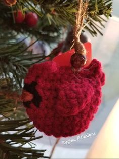 a crocheted ornament hanging from a christmas tree