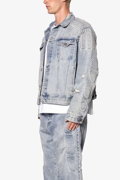 the Moto Trucker Jacket is designed with an oversized fit and features a cropped body, extended sleeves, button placket, and finished with padded moto inspired details on the shoulders and sleeves. Details oversized fit 100% cotton Model is 6’0, 140 lbs and wears a size medium Denim Patchwork, Trucker Jacket, Denim Flares, Flannel Shirt, Cargo Shorts, Flare Pants, Black Denim, Oversized Fits, Black Hoodie