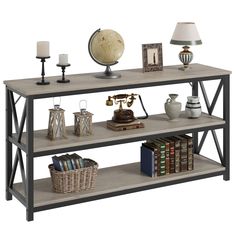 a shelf with books, lamps and pictures on it in front of a white background