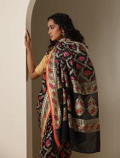 An exclusive Banarasi Handloom saree from Khinkhwab. Add a dash of your favorite color to your ethnic look with this beautiful Banarasi saree from our Birds of Paradise collection. The Saree is made of pure Georgette silk and has the illustrious birds motifs weave. Jaal weave is inherent to Banarasi weaving and this saree is the epitome of the craftsmanship of the renowned weavers of Banaras. Chanderi Meenakari Pre-draped Saree For Navratri, Traditional Pre-draped Meenakari Saree In Dola Silk, Self Design Pre-draped Saree For Navratri, Unstitched Saree With Meenakari, Black Banarasi Silk Pre-draped Saree With Self Design, Pre-draped Meenakari Saree For Eid, Festive Black Dupatta With Meenakari, Traditional Diwali Pre-draped Saree With Meenakari, Diwali Meenakari Pre-draped Saree