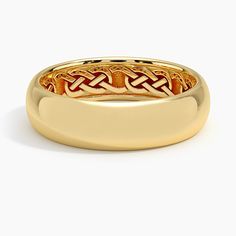 a gold ring with an intricate design on it