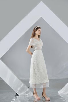 Kenna Straight Cape Sleeved Organza Midi Dress | MEAN BLVD Lace Tiered Skirt Maxi Dress For Summer, Sheer Midi Dress For Wedding, Elegant Midi-length Mesh Dress, Sheer Wedding Midi Dress, Elegant Sheer Dress For Wedding Guest, Elegant Sheer A-line Maxi Dress, Elegant A-line Maxi Dress With Sheer Details, Short Sleeve Lace Dress With Sheer Sleeves, Elegant Summer Midi Dress With Sheer Sleeves