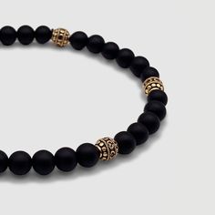 Effortless style is good manners. CRAFTD for individuality, every semi-precious Onyx stone displays its own unique markings, resulting in a truly one-of-a-kind piece. Enhanced with 18K gold beads, its relaxed aesthetic becomes the ideal companion for those essential laid-back days. Qualities: Sharpened Focus ✓ Semi-Precious Onyx Stone✓ 18K Gold & 316L Stainless Steel ✓ Water, Heat, Sweat Resistant Model is 5'11 & Wears Size 19cm. Adjustable Gold Onyx Bracelet, Adjustable Gold Onyx Bracelets, Classic Onyx Jewelry With Gemstone Beads, Modern Polished Beads Bracelet, Elegant Onyx Jewelry With Polished Beads, Spiritual Onyx Jewelry With Gemstone Beads, Classic Onyx Beaded Bracelets With Adjustable Fit, Classic Natural Stone Bracelets As Gift, Classic Adjustable Gemstone Bracelet