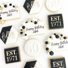 decorated cookies with black and white icing for 50th birthday