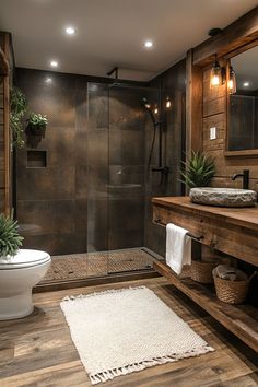 a bathroom with a toilet, sink and shower stall is pictured in this image from the front view