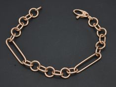 "This charming Real 14K Solid Rose Gold 7 1/4\" Paperclip Charm Oval Chain Textured Bracelet 4.2gr is crafted from 14K solid rose gold, featuring a paperclip charm and an oval chain with a textured pattern. The 71/4\" piece weighs 4.2 grams, providing a comfortable, secure fit. This timeless design is perfect for any occasion and makes a great addition to any jewelry collection. The real rose gold finish adds a touch of elegance to this classic bracelet. Specifications: Metal: Real 14K Solid Ros Rose Gold Chain Link Bracelet For Formal Occasions, Formal Rose Gold Chain Link Bracelet, 14k Rose Gold Link Chain Bracelet, Classic Rose Gold Link Chain Bracelet, Rose Gold Oval Link Paperclip Bracelet, Rose Gold Oval Link Chain Bracelet, Formal Rose Gold Cable Chain Bracelet, Rose Gold Link Bracelet With Solid Construction, Rose Gold Link Chain Bracelet With Lobster Clasp