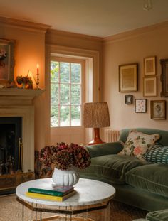 a living room filled with furniture and a fire place