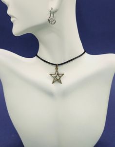 Add a touch of celestial elegance with our Star Charm Necklace, a beautiful piece that shines with every outfit. Embrace the nostalgic vibes of the early 2000s with our trendy Y2K Necklace, perfect for a retro-inspired look. Explore the mysteries of the universe with our Sacred Geometry collection, featuring intricate designs that captivate and inspire. The Star Choker Necklace offers a delicate yet bold statement, while our Charm Choker Necklace is perfect for layering and personalization. For Trendy Star Charm Festival Jewelry, Trendy Adjustable Jewelry With Star Charm, Star-shaped Metal Choker As Gift, Star-shaped Metal Choker For Gift, Festival Choker Necklaces With Adjustable Cord, Festival Choker Necklace With Adjustable Cord, Star Charm Necklace For Festivals, Bohemian Star Charm Choker, Festival Jewelry Choker With Adjustable Cord