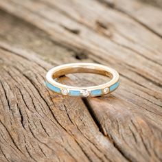 a close up of a ring on a wooden surface