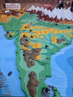 a map of india with mountains and rivers painted on the ground in different colors, shapes and sizes