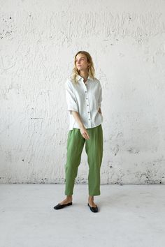 Linen Shirts combine a classic neckline and a comfortable loose cut. This fits perfectly in different body shapes and heights and visualizes our unique vision on basic pants. With this shirt, You could easily and quickly create an incredibly comfy and stylish everyday city look. This is perfect with almost everything, from linen pants to shorts, sneakers, or heels. You'll find them so easy to wear. D E S C R I P T I O N * Relaxed fit * Classic neckline * 3/4 sleeves  * Buttons closure * Can be w Green Everyday Shirt With Buttons, Green Tops With Buttons And Relaxed Fit, Green Relaxed Fit Top With Buttons, Casual Green Blouse With Button Cuffs, Relaxed Button-up Shirt For Casual Gatherings, Effortless Blouse With Relaxed Fit, Linen Tops With Buttons For Casual Gatherings, Casual Cotton Blouse With Buttons, Effortless Blouse With Relaxed Fit And Placket